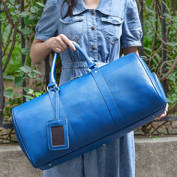 Extra Large Leather Duffle Bag with Shoe Compartment Blue carrying by hand