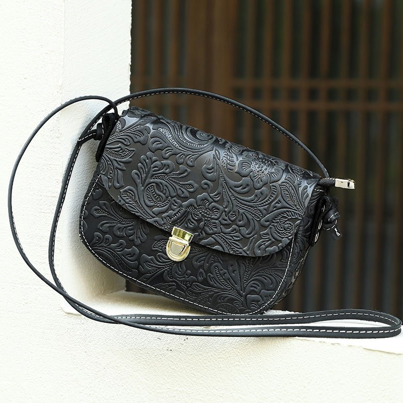 Floral Embossed Leather Small Crossbody Bag Black on the window