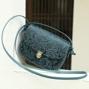 Floral Embossed Leather Small Crossbody Bag Teal on the window