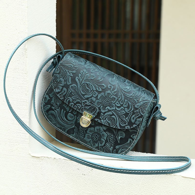 Floral Embossed Leather Small Crossbody Bag Teal on the window