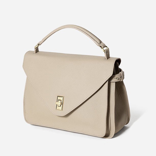 side of Togo Leather Top Handle Crossbody Bag Beige