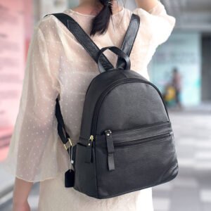 Grain Leather Medium Backpack with Multi Pockets Black carrying on a woman's back